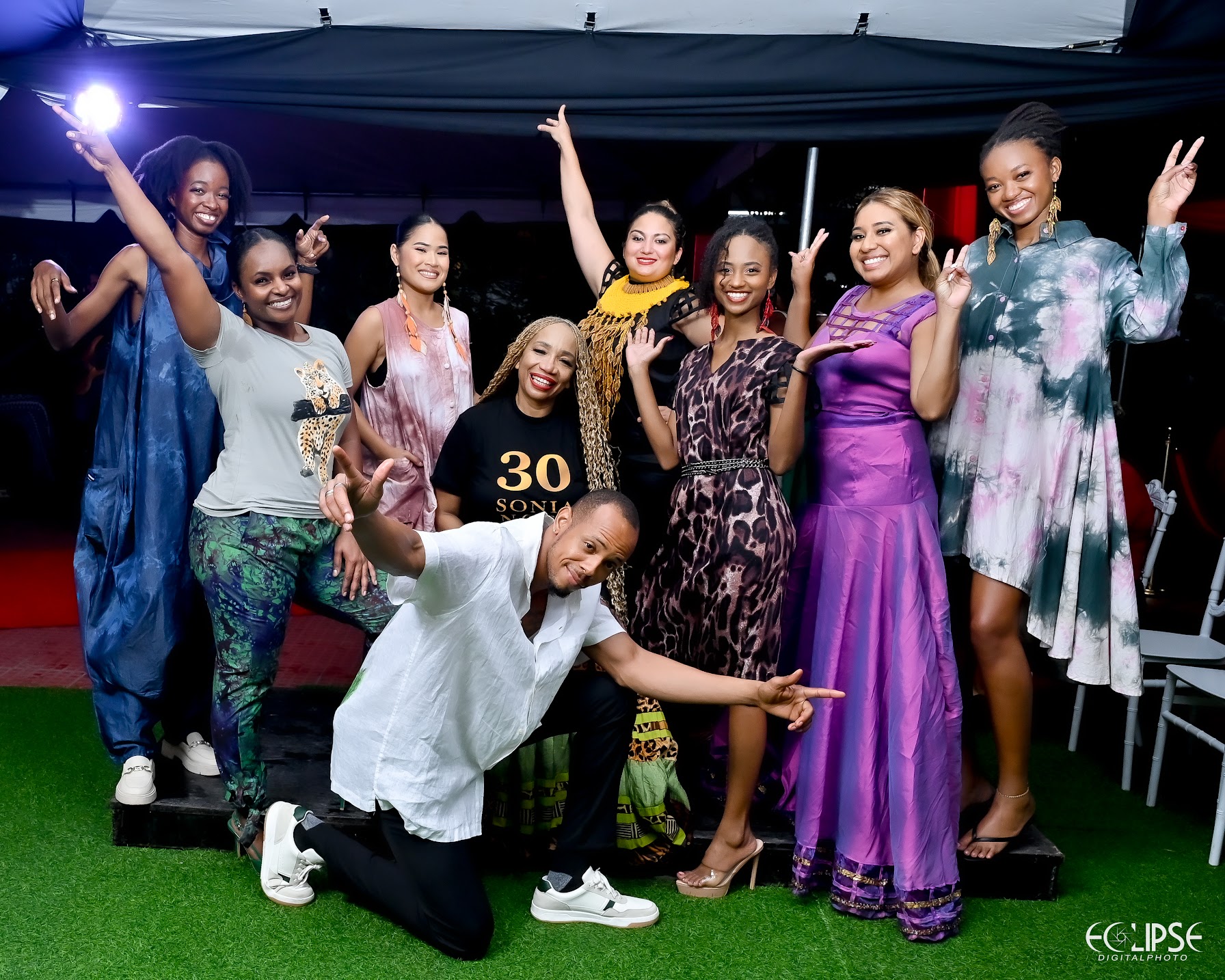 Sonia Noel with the model cast celebrating after the runway presentation