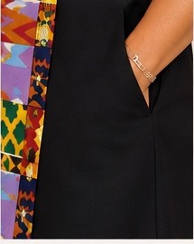 Style #404 Woven Stories Panel Dress detail — patchwork panel with pocket close-up