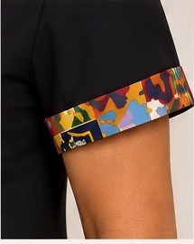 Style #404 Woven Stories Panel Dress detail — patchwork print short sleeve cuff close-up